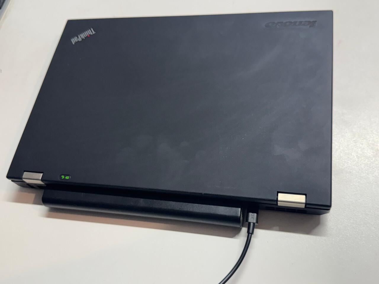 T430 charging via USB-C cable with green indicator LEDs lit