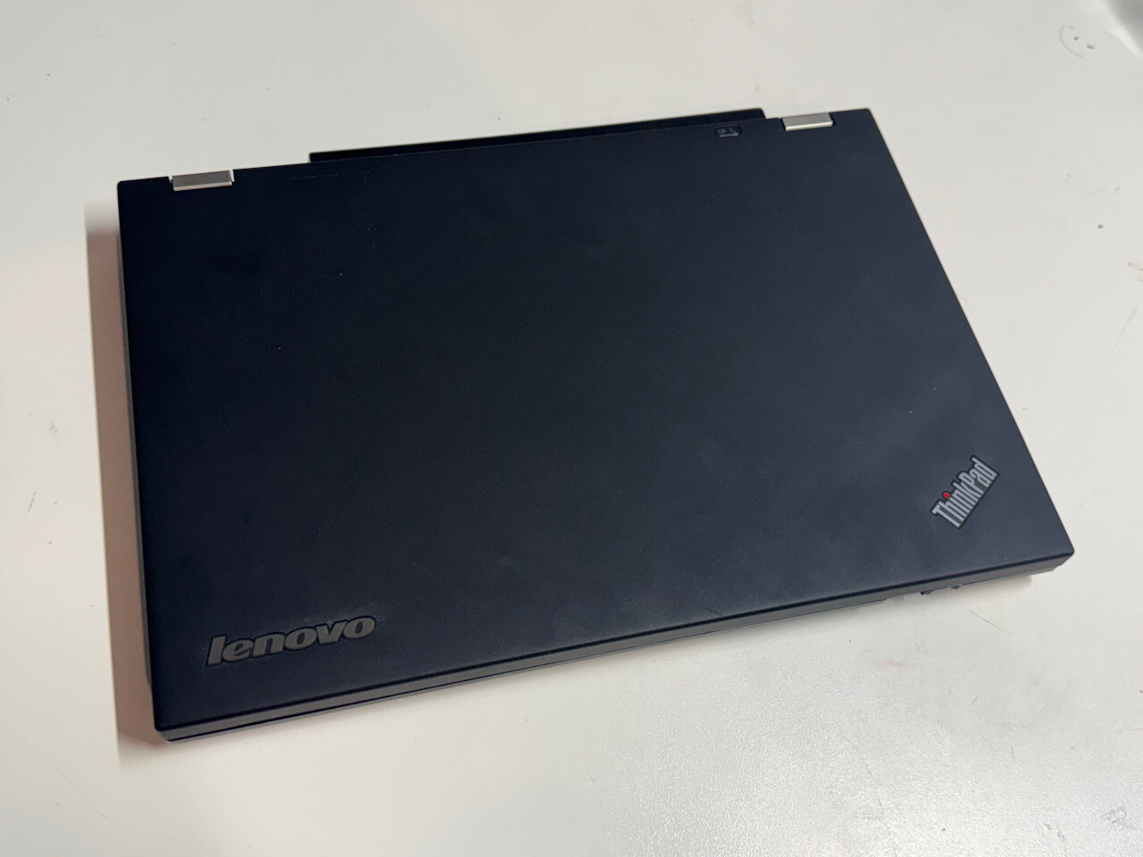 Lenovo ThinkPad T430 closed, showing the lid with ThinkPad and Lenovo branding