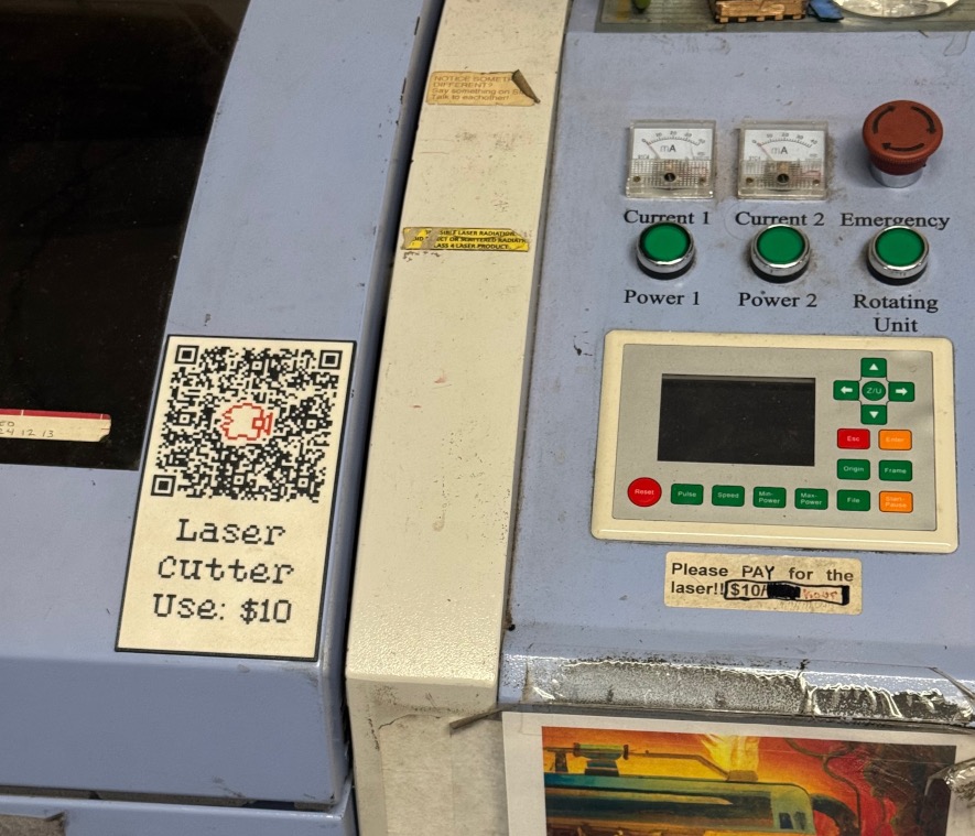 A QR code on a large laser cutting machine