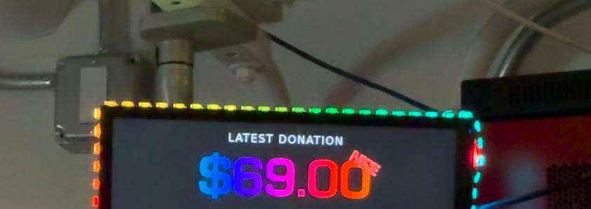 A cropped image of a display showing just the top with a rainbow colored $69.00 donation amount